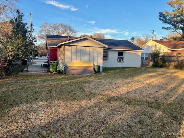 exterior space with a lawn and cooling unit