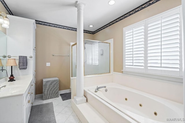 bathroom with a wealth of natural light, tile patterned flooring, vanity, and shower with separate bathtub