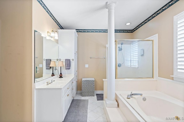 bathroom with decorative columns, plus walk in shower, tile patterned flooring, and vanity