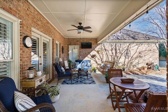 view of patio / terrace with ceiling fan and an outdoor living space