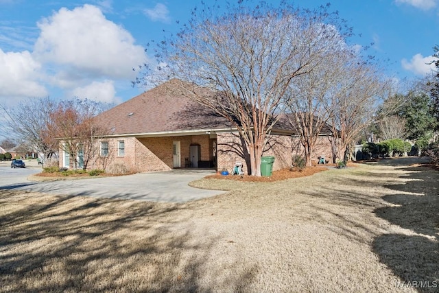 back of property featuring a carport