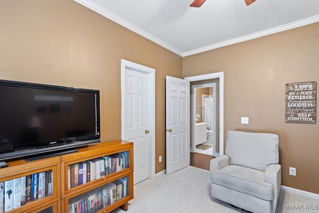 living area featuring ceiling fan, crown molding, and light carpet