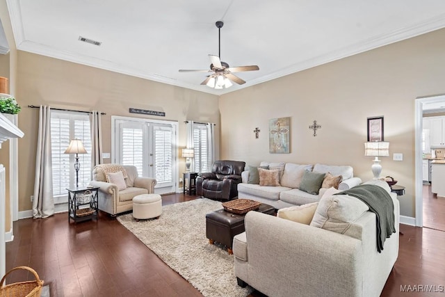 living room featuring dark hardwood / wood-style floors, ceiling fan, crown molding, and french doors