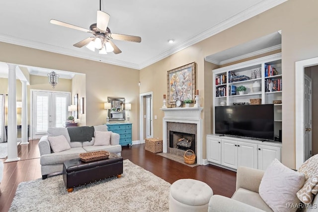 living room with french doors, ornate columns, ceiling fan, crown molding, and dark hardwood / wood-style floors