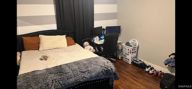 bedroom featuring dark wood-type flooring