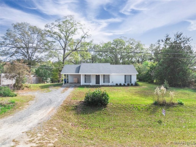 single story home featuring a carport and a front yard