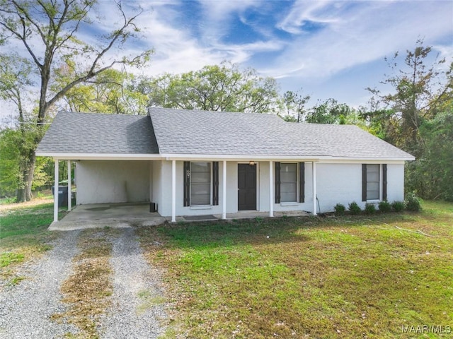 ranch-style house with a carport, a porch, and a front yard