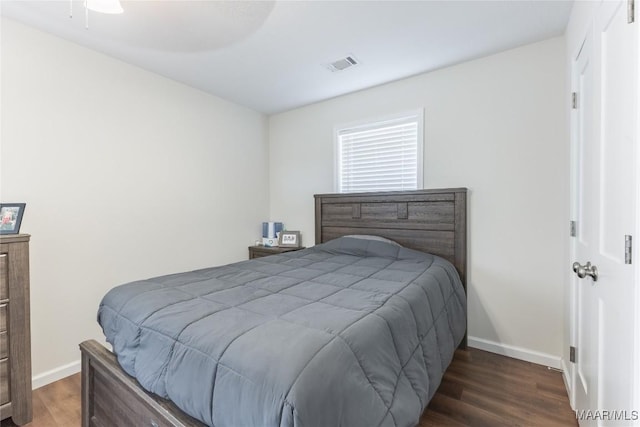 bedroom featuring ceiling fan and dark wood-type flooring