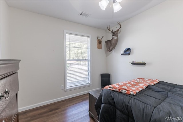 bedroom featuring ceiling fan and dark wood-type flooring