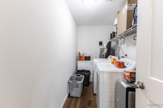 laundry room featuring separate washer and dryer and dark hardwood / wood-style floors