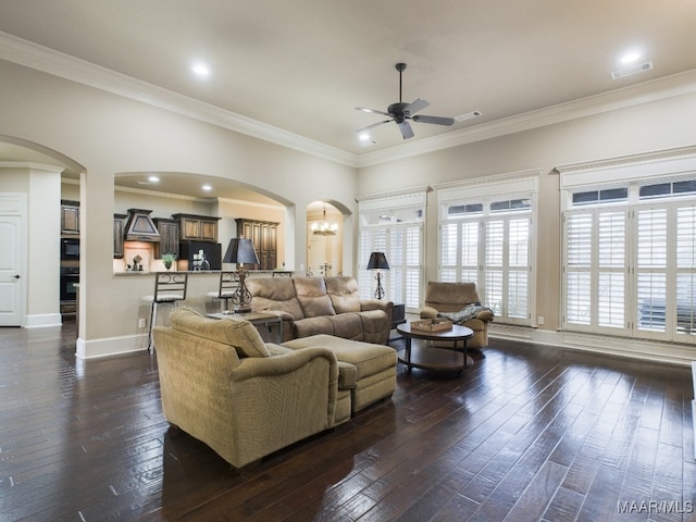 8513 Rockbridge Cir, Montgomery, AL 36116 - living room featuring arched walkways, a ceiling fan, dark wood-style floors, crown molding, and baseboards