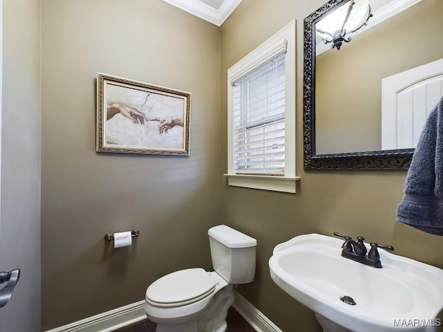8513 Rockbridge Cir, Montgomery, AL 36116 - half bathroom featuring a sink, baseboards, toilet, and crown molding