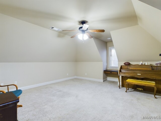 8513 Rockbridge Cir, Montgomery, AL 36116 - living area with vaulted ceiling, a ceiling fan, light colored carpet, and baseboards