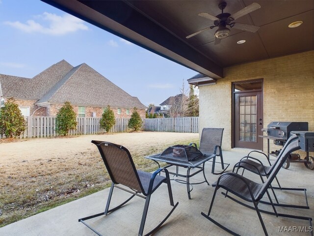 8513 Rockbridge Cir, Montgomery, AL 36116 - fenced backyard featuring ceiling fan, a patio area, and a grill