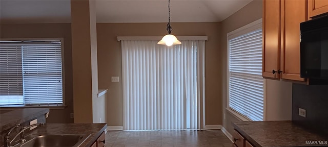 kitchen featuring hanging light fixtures and sink