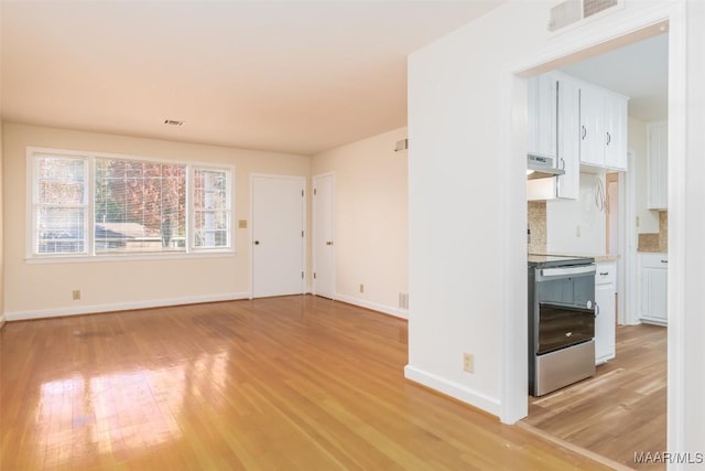 unfurnished living room featuring light hardwood / wood-style floors