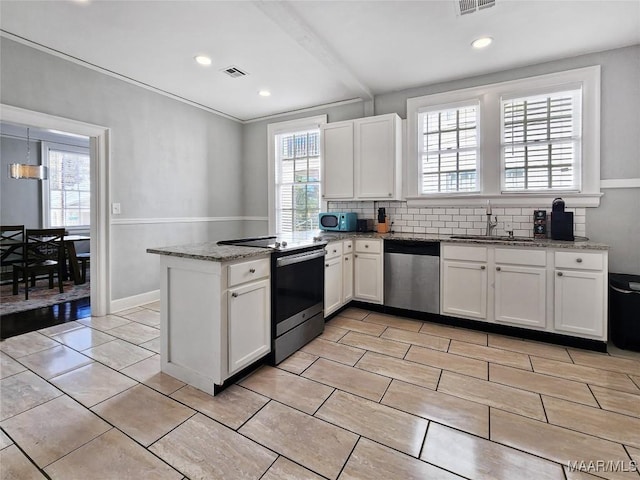 kitchen with electric range, dishwasher, and white cabinets