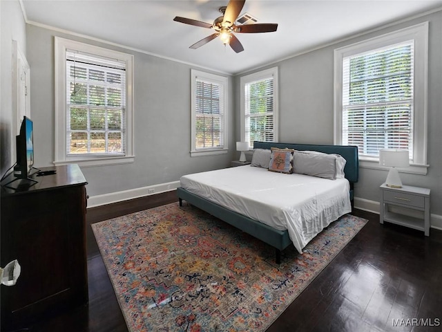 bedroom featuring ceiling fan, crown molding, and dark hardwood / wood-style floors