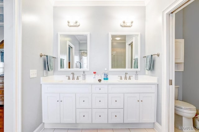 bathroom with tile patterned floors, vanity, and toilet