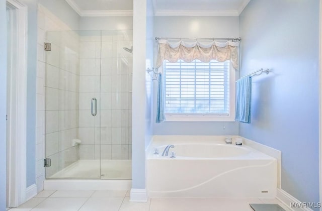 bathroom with tile patterned flooring, crown molding, and independent shower and bath