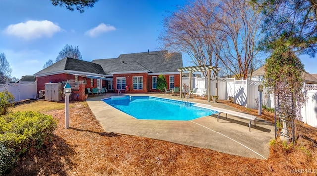 view of pool featuring a patio area and a diving board