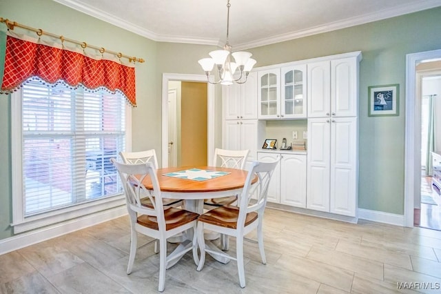 dining room with ornamental molding and an inviting chandelier