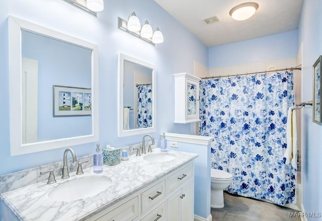 bathroom with walk in shower, vanity, and toilet