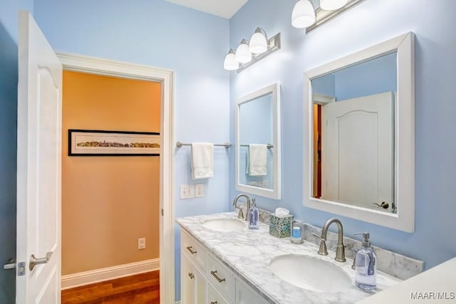 bathroom with vanity and hardwood / wood-style flooring