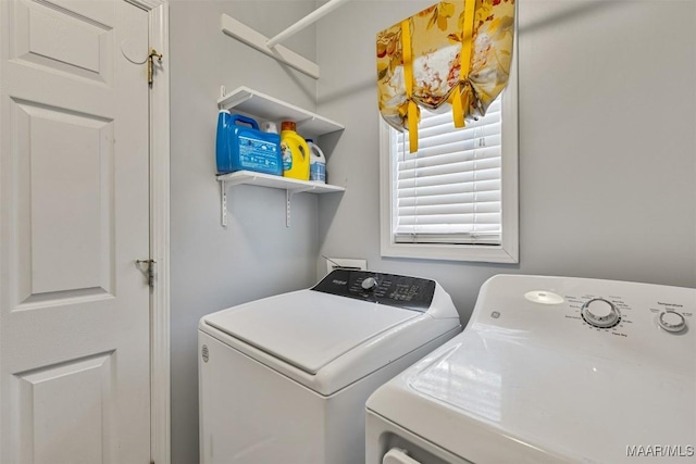 washroom with washer and dryer