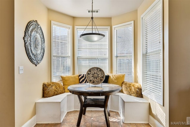 tiled dining area with breakfast area