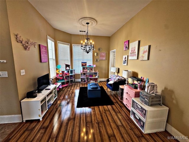 interior space with dark hardwood / wood-style flooring and a notable chandelier