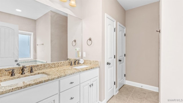 bathroom with vanity and tile patterned floors