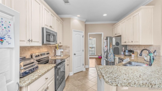 kitchen featuring backsplash, stainless steel appliances, crown molding, and sink