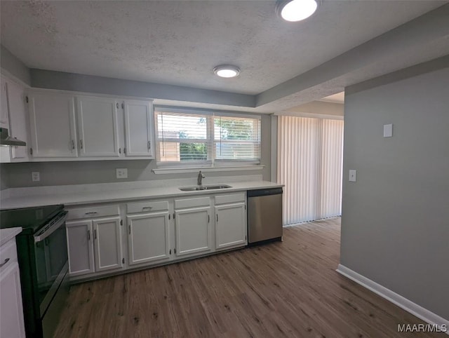 kitchen with white cabinets, dark hardwood / wood-style flooring, stainless steel appliances, and sink