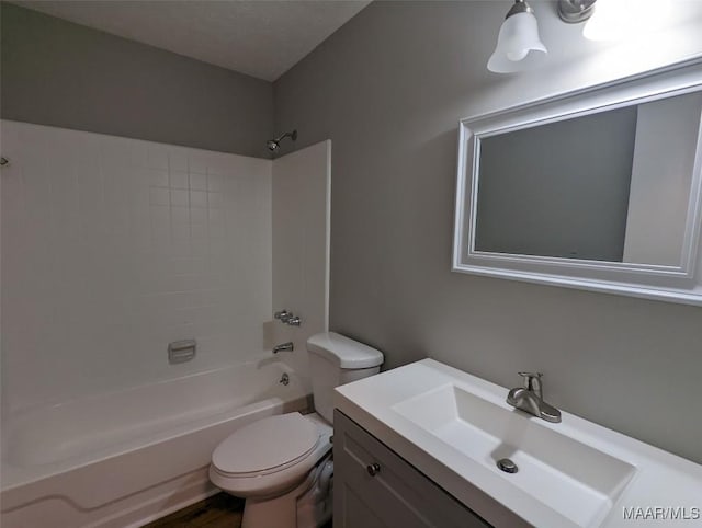 full bathroom featuring hardwood / wood-style flooring, vanity, toilet, and bathtub / shower combination