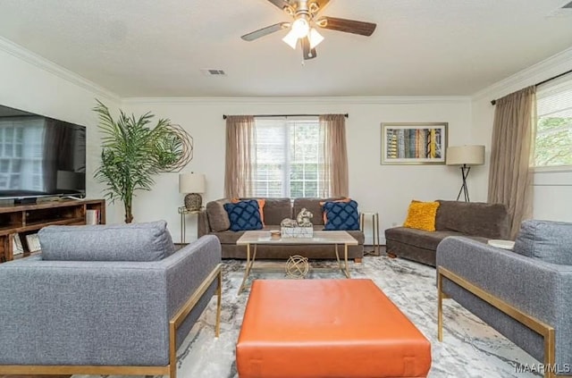 living room featuring ceiling fan and crown molding