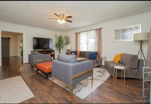 living room with ceiling fan, dark hardwood / wood-style flooring, and ornamental molding