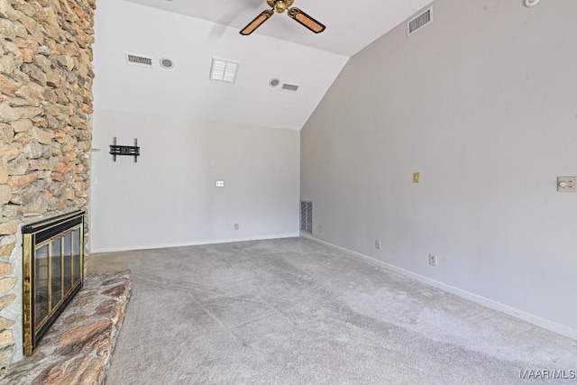 unfurnished living room featuring a fireplace, carpet flooring, ceiling fan, and lofted ceiling