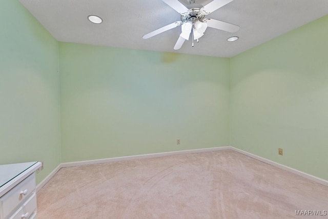 carpeted empty room with ceiling fan