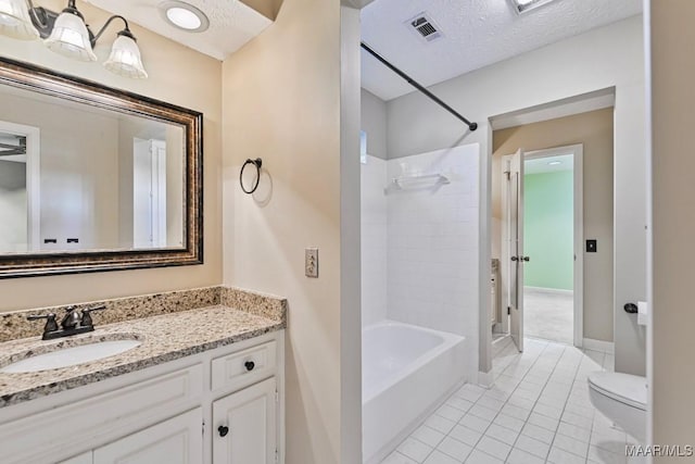 full bathroom with tile patterned flooring, a textured ceiling, toilet, vanity, and bathtub / shower combination