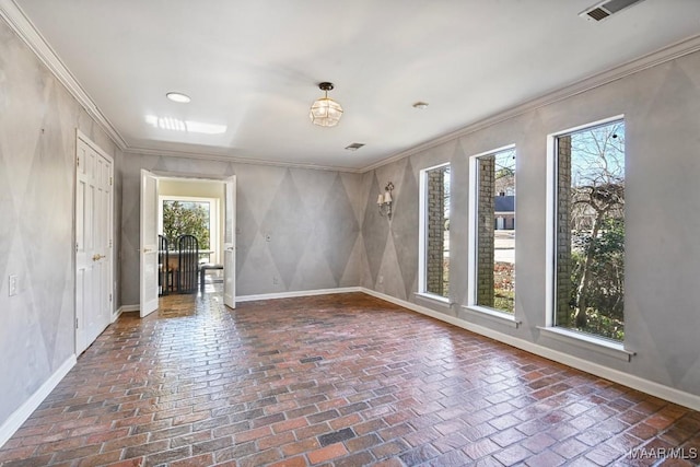 unfurnished room featuring ornamental molding