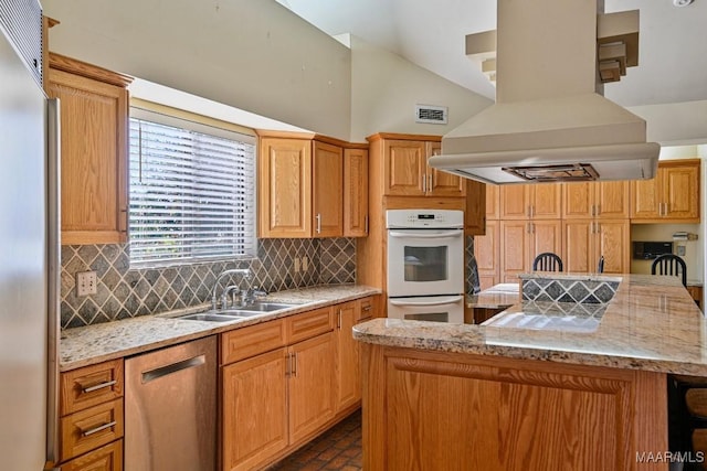 kitchen featuring sink, stainless steel dishwasher, a kitchen island, fridge, and island range hood