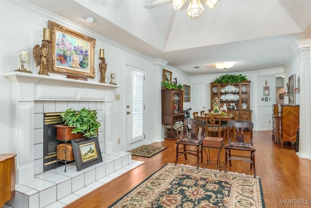 dining room featuring ceiling fan, crown molding, and light hardwood / wood-style flooring