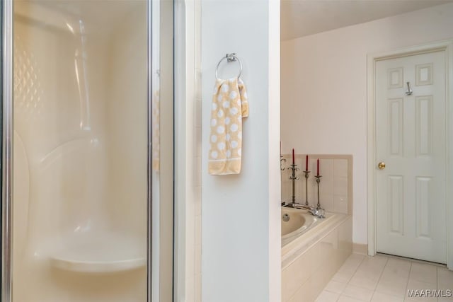 bathroom featuring shower with separate bathtub and tile patterned floors