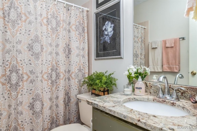 bathroom with vanity and toilet