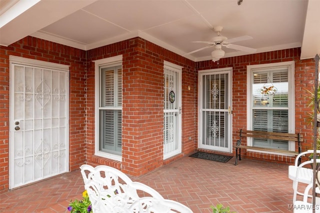 view of patio featuring ceiling fan