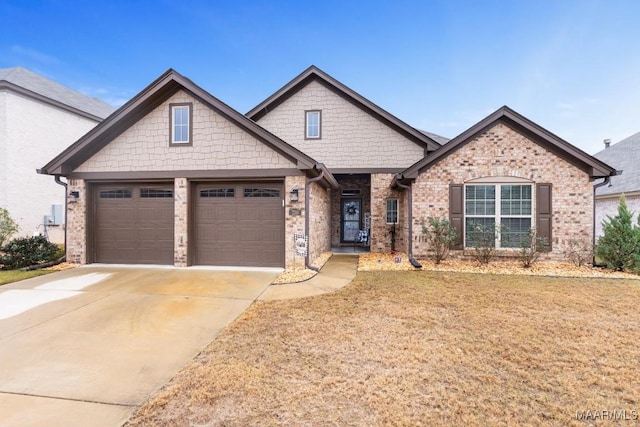 craftsman inspired home with a front yard and a garage