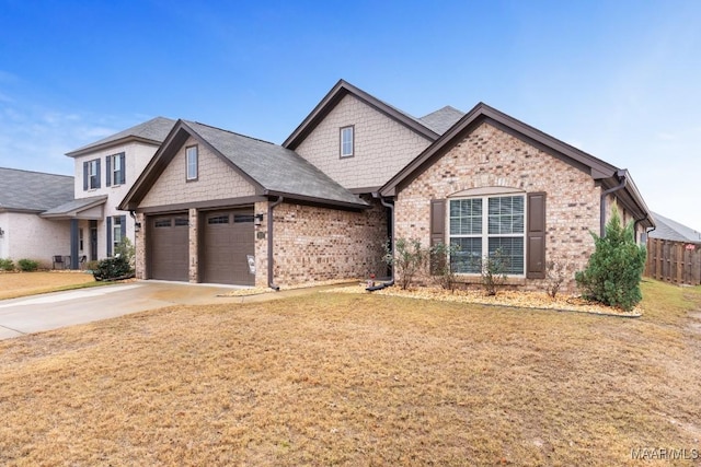 view of front of property featuring a garage and a front lawn