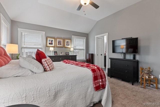 carpeted bedroom featuring vaulted ceiling and ceiling fan