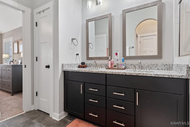 bathroom with tile patterned flooring and vanity